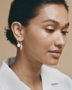 Wouters&Hendrix – trio van oorbellen met kraaienpoot, zoetwaterparel en kristal